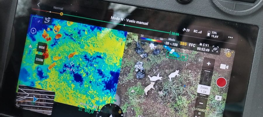 A drone controller showing a thermal image alongside an aerial view of an experimental site